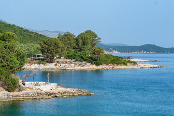 Naklejka na ściany i meble Beautiful landscape of the Ksamil waterfront in summer, Albania.