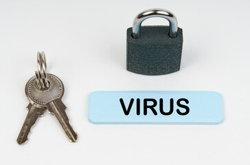 On a white surface there is a lock, keys and a blue sign with the inscription - Virus