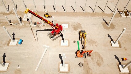 large construction site with crane and excavators, high quality image, aerial view