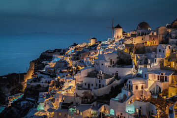 Scenic blue hour at Oia, the most typical village of Santorini and popular honeymoon destination, Greece