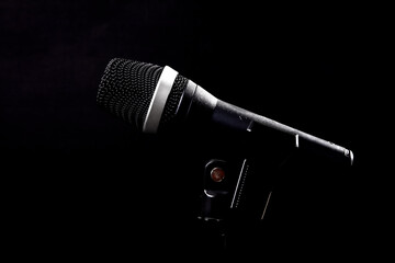 black microphone on black background
