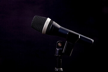 black microphone on black background