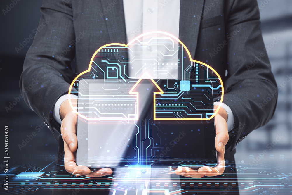 Poster close up of businessman hands holding tablet with glowing circuit cloud hologram on blurry office in