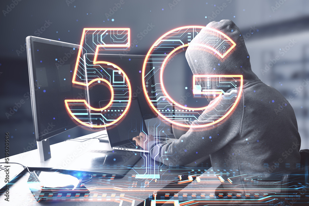 Poster side view of hacker hands using computers at desktop with creative 5g hologram on blurry office inte