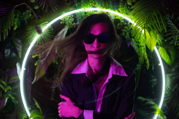 Portrait of asian man wearing sunglasses in neon light. 