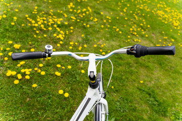 Obraz na płótnie Canvas bicycle handlebar with bell and speed switch close-up