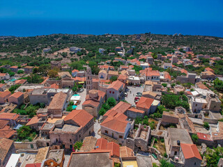 Fototapeta na wymiar Aerial view of the beautiful seaside town Areopoli with traditional architectural buildings and stoned houses in Laconia, Greece