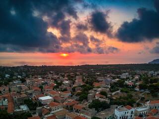 Fototapeta premium Aerial view of the beautiful seaside town Areopoli with traditional architectural buildings and stoned houses in Laconia, Greece
