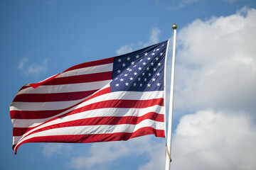 Obraz premium American Flag Waives In The Breeze