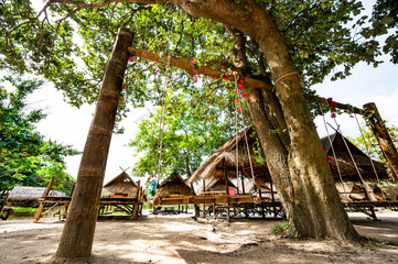 Wood swing with hut beside Huay Tung Tao Lake