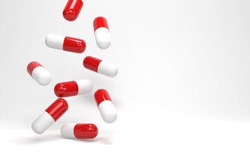 3D illustration, 3D rendering. Antibiotic pill capsules falling on white background. Healthcare and medical concept