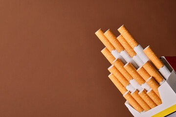 tobacco pack on one side of the image with cigarettes coming out irregularly in steps