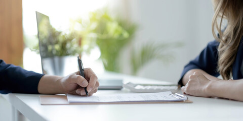 Close up of male hand putting signature, running own small business, have a contract in place to...