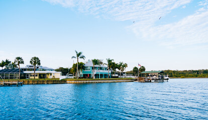 Fototapeta premium Riverview, Florida, USA - 02 10 2022: River view house and dock along Little Manatee River 