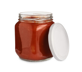 Glass jar of delicious canned lecho and lid on white background