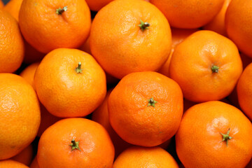 Delicious fresh ripe tangerines as background, closeup