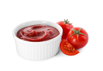 Tasty ketchup in bowl and fresh tomatoes isolated on white