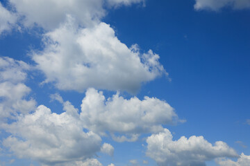 Beautiful blue sky with white fluffy clouds