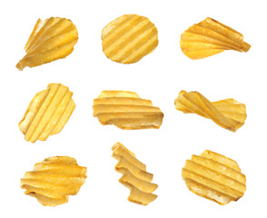 Set of ridged crispy potato chips on white background