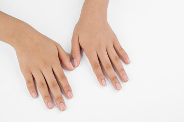 Hands of a young woman, hand and nail care with white background and copy space