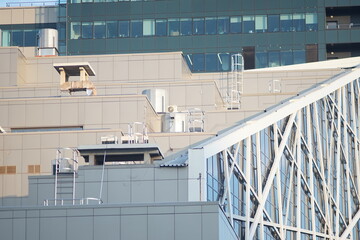 Horizontal full-color photo. Urban landscape. Geometric composition of parts of facades of high-rise buildings.