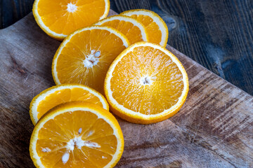 ripe orange cut into slices during cooking