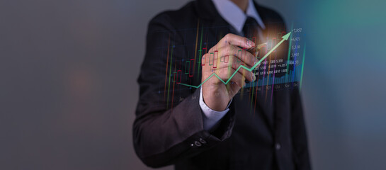 Businessman in Hand touching graphs of financial indicator and accounting market economy analysis chart