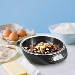 kitchen table on which electronic scales with nuts