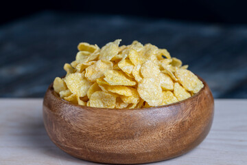 dry breakfast corn flakes of yellow color , close up