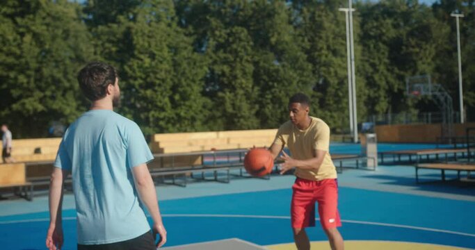 Basketball player does three point shot smiling friend greets