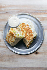 Chicken wrap with romaine lettuce, parmesan cheese,  croutons and grilled chicken with caesar dressing