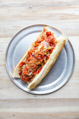 Angus Beef Hot Dog with ham, american cheese, crispy bacon, tomato, cooked red pepper & onions and mayo
