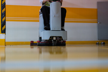 cleaning floor with machine	