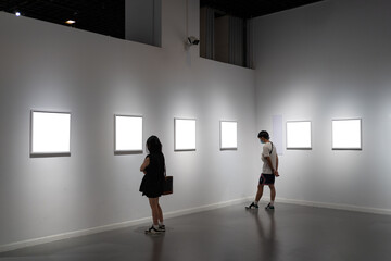 interior of gallery with blank frame - obrazy, fototapety, plakaty
