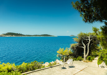 Sea landscape, Adriatic Sea, Croatia, two rocky islands on the horizon, an observation deck