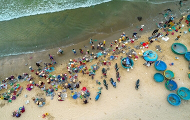 Mui Ne fish market seen from above, the morning market in a coastal fishing village to buy and sell...