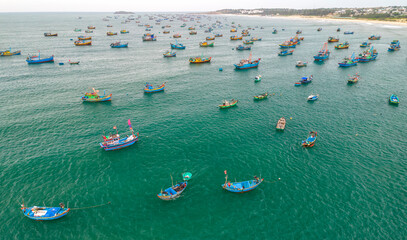 Mui Ne fishing village seen from above with hundreds of boats anchored to avoid storms, this is a...