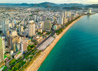 Fototapeta na wymiar The coastal city of Nha Trang seen from above in the morning, beautiful coastline. This is a city that attracts to relax in central Vietnam