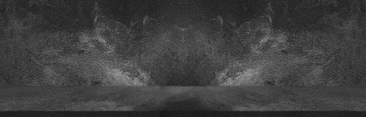 Dark black wide horizontal decorative cement wall room background with light and shadow abstract wallpaper background