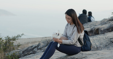 Woman go hiking with her dog