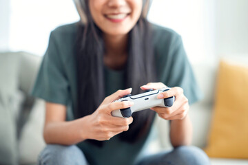 Closeup Hand of woman playing a computer games with joystick.