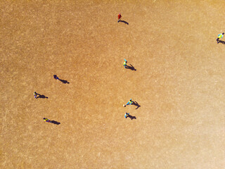 Abstract Defocused Background from aerial photo of children playing soccer in a field located on top of a hill on a hot day in the Cikancung area. Indonesia