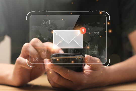 email marketing concept. Businessman checking email on mobile phone with email icon, electronic mail, e-commerce. newsletter email and protect your personal information from spam mail concept