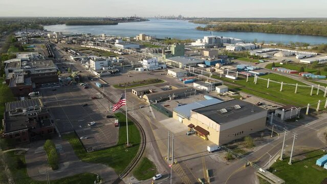 BASF Chemical Corporation with waving flag of USA, fly away drone view