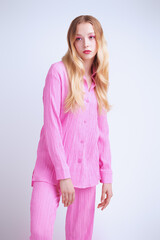 model in pink pantsuit