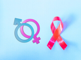 Red Ribbon Support HIV, AIDS and Male and female gender signs.on blue background and copy space for...