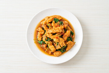 stir-fried fried fish with basil and chili in thai style