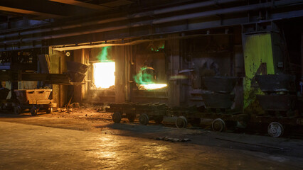 The process of loading copper ore into a gas furnace.