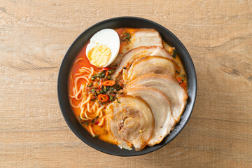 Ramen Noodles Spicy Tomyum Soup with Roast Pork