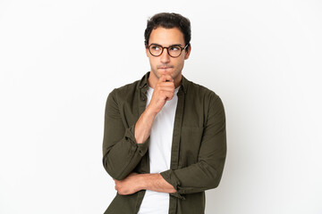 Caucasian handsome man over isolated white background having doubts and thinking